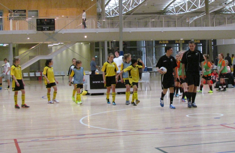 soccer players warming up for the indoor match