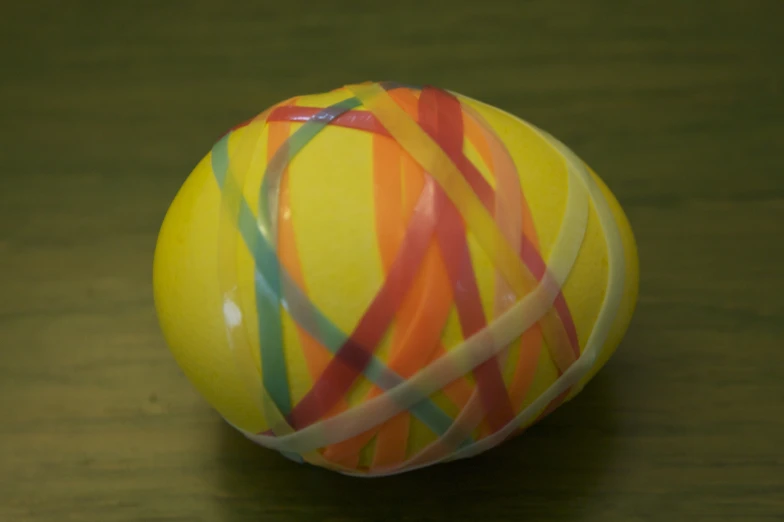 the ball is decorated with colorful ribbons on it