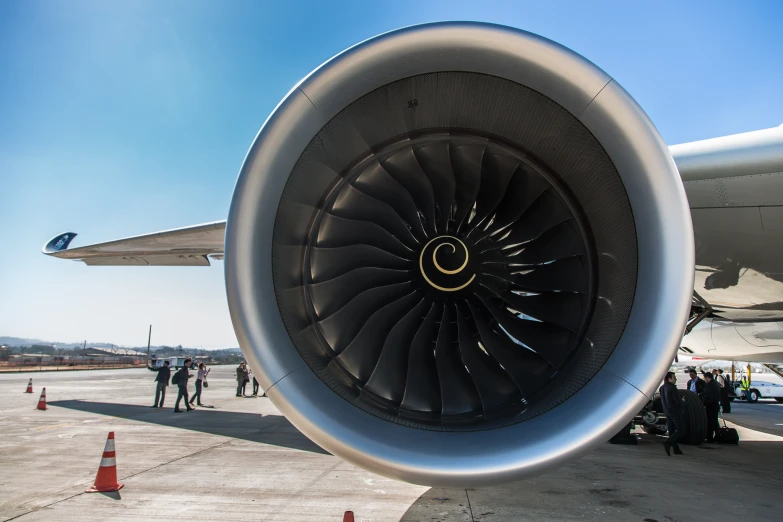 a jet engine on the back of a commercial airplane