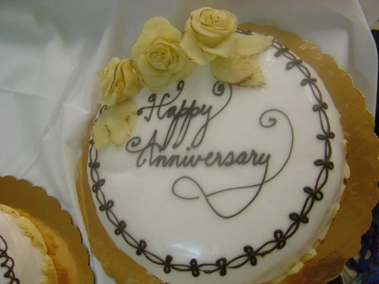a cake with a candle and frosting written in it