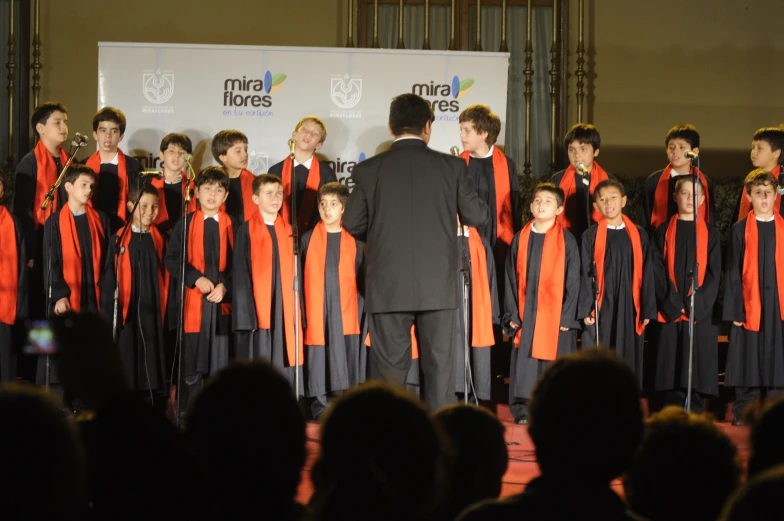 a group of people in a choir at a performance