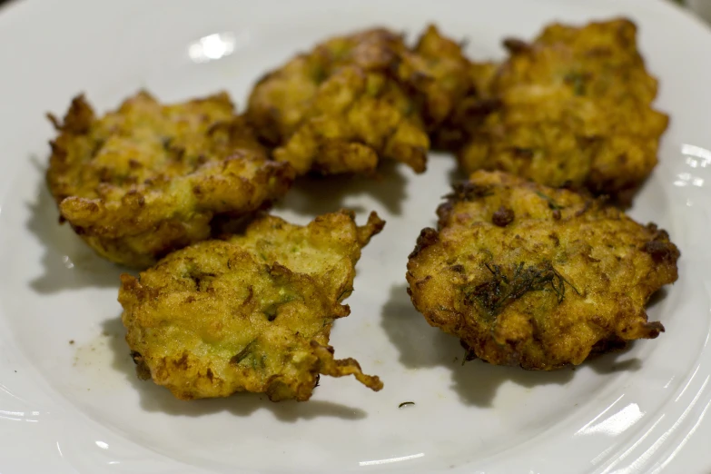 small pieces of fried food on a white plate