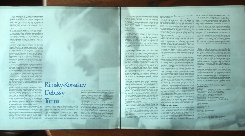 open book with newspaper clipping about rompsh - kosheron's poem