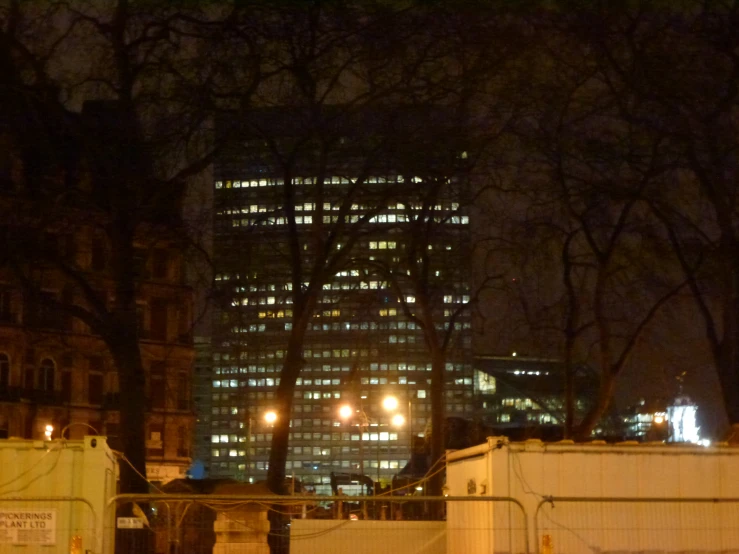 a night view of a large building in the city