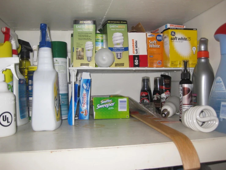 a shelf filled with lots of cleaning products