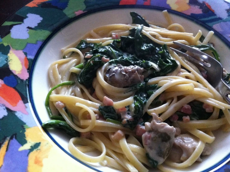 a dish with noodles and vegetables in sauce