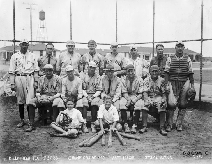 a group of men pose for a team po