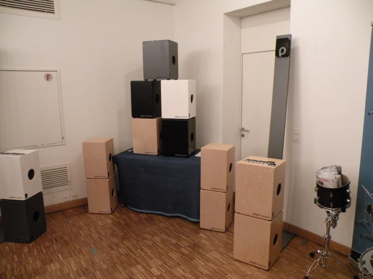 some boxes sitting on the floor with some kind of bed