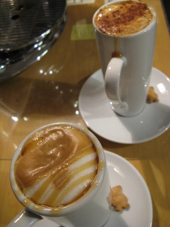 a couple cups filled with food on top of a table