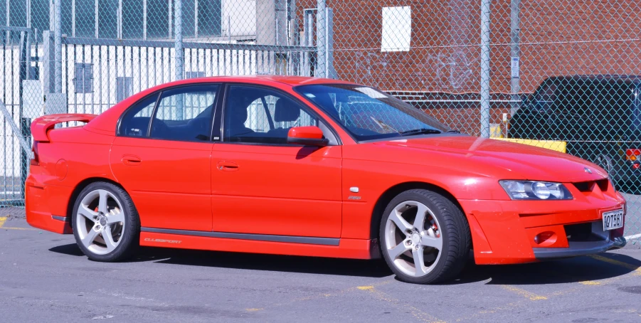 a red car parked in a parking lot