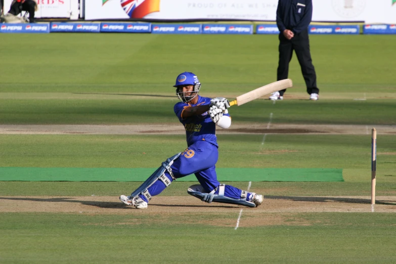 man batting while holding onto bat on field