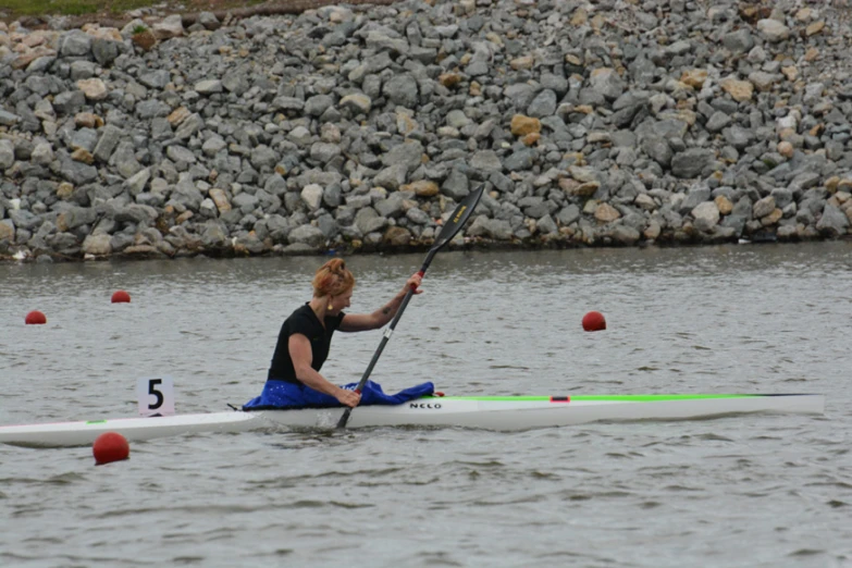 a person in a boat on some water