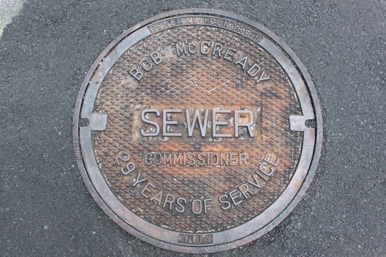a manhole cover with the word sever painted on it