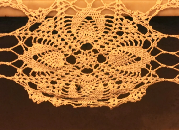 a close up view of a crochet doily