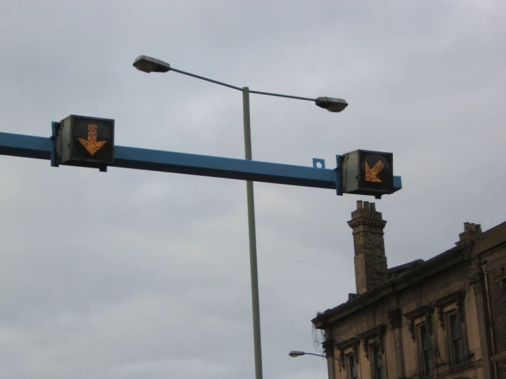 two traffic lights that are attached to a pole