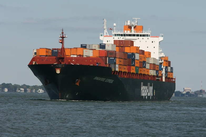 an industrial shipping vessel is at anchor in the middle of the water