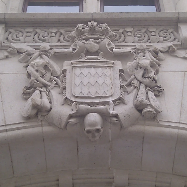 a gothic style coat of arms on a building