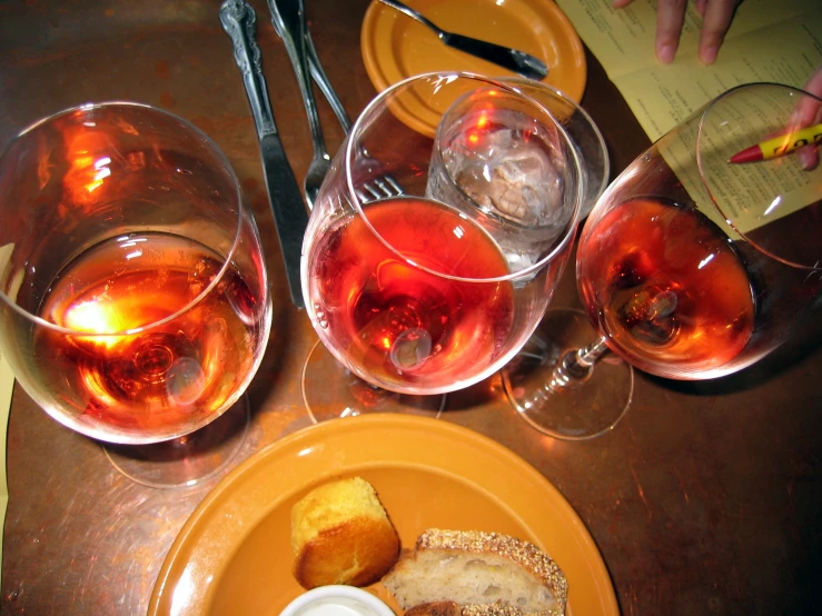 some glasses and bread on a table