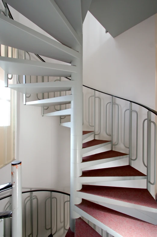 a set of white and red stair bars