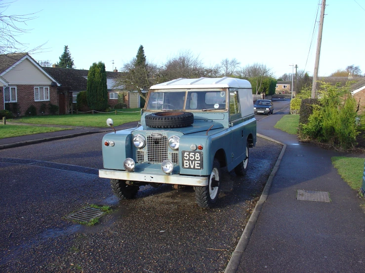 an old style truck is parked on the street