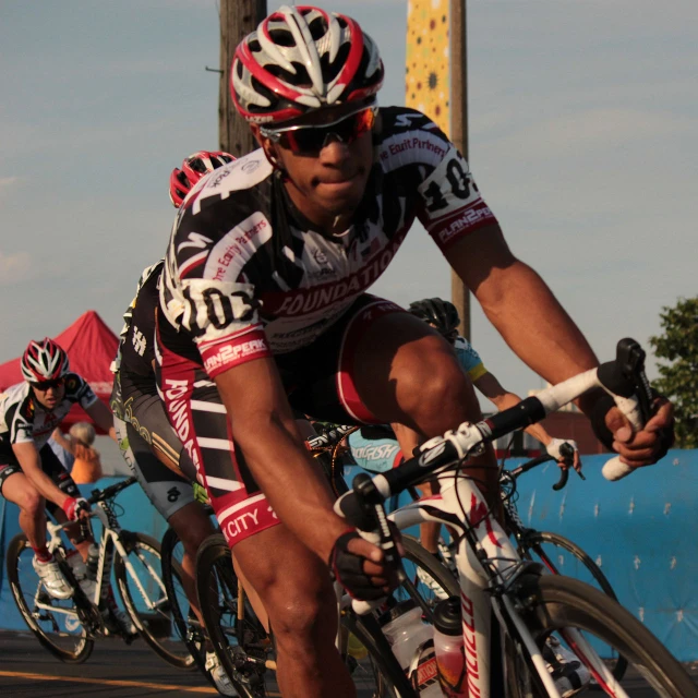 a group of cyclists passing each other on a street