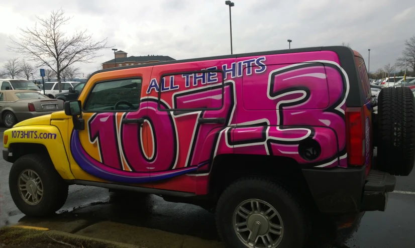 an all the hits jeep is parked in the parking lot