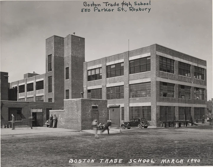 black and white po of students in front of a school building