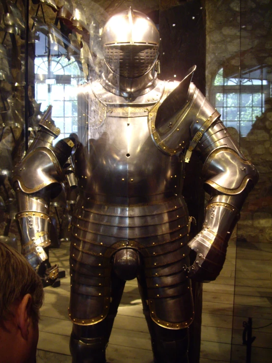 an armored man with a helmet and many hands in his other hand