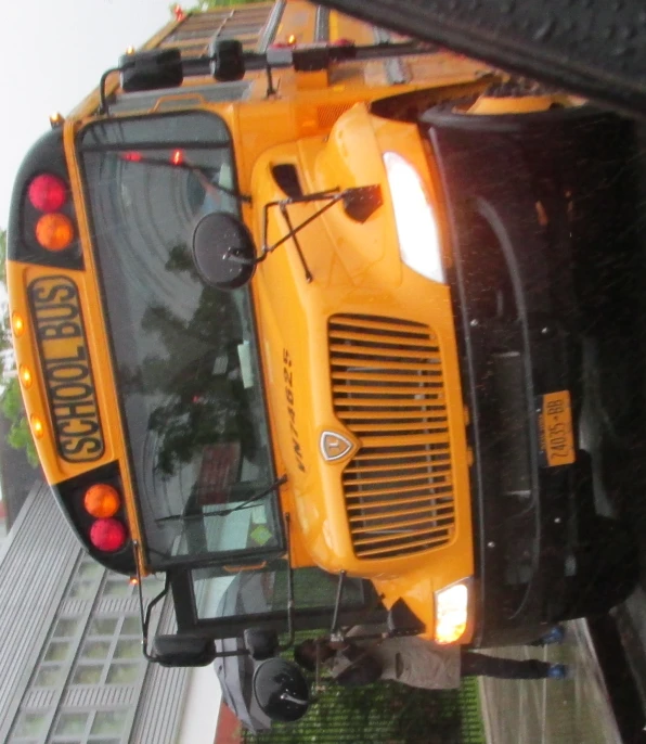 an image of school bus driver on the road