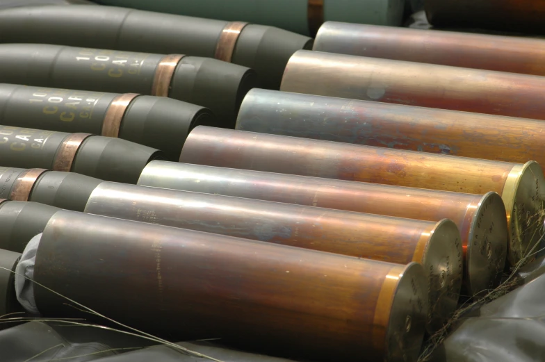 a number of shiny gray and gold pipes