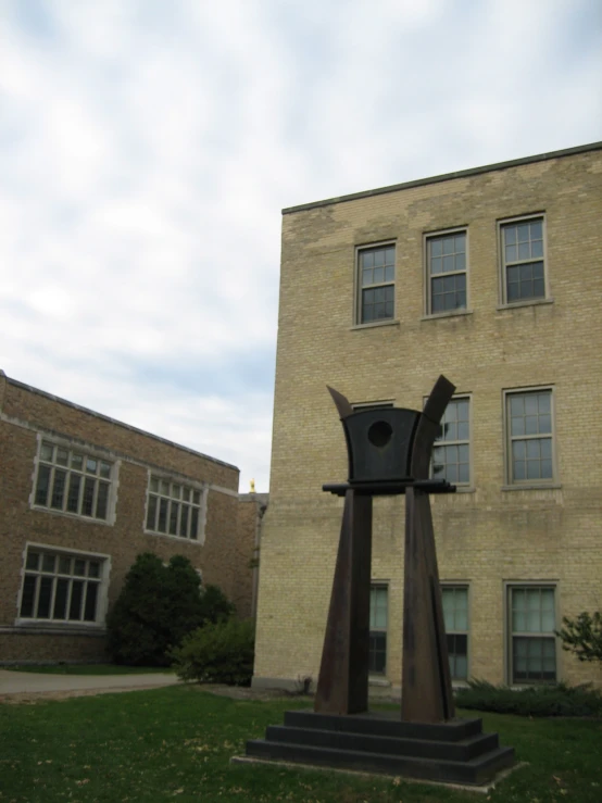 a clock tower stands in front of a building