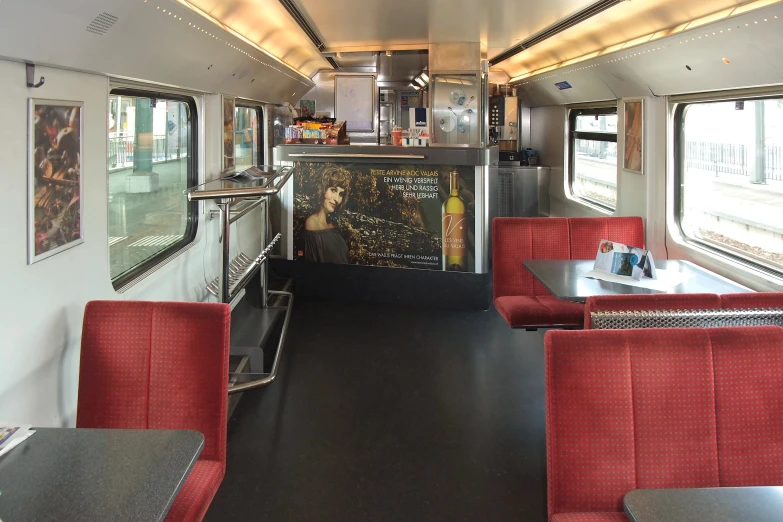 a view from inside a bus looking toward the table and chairs