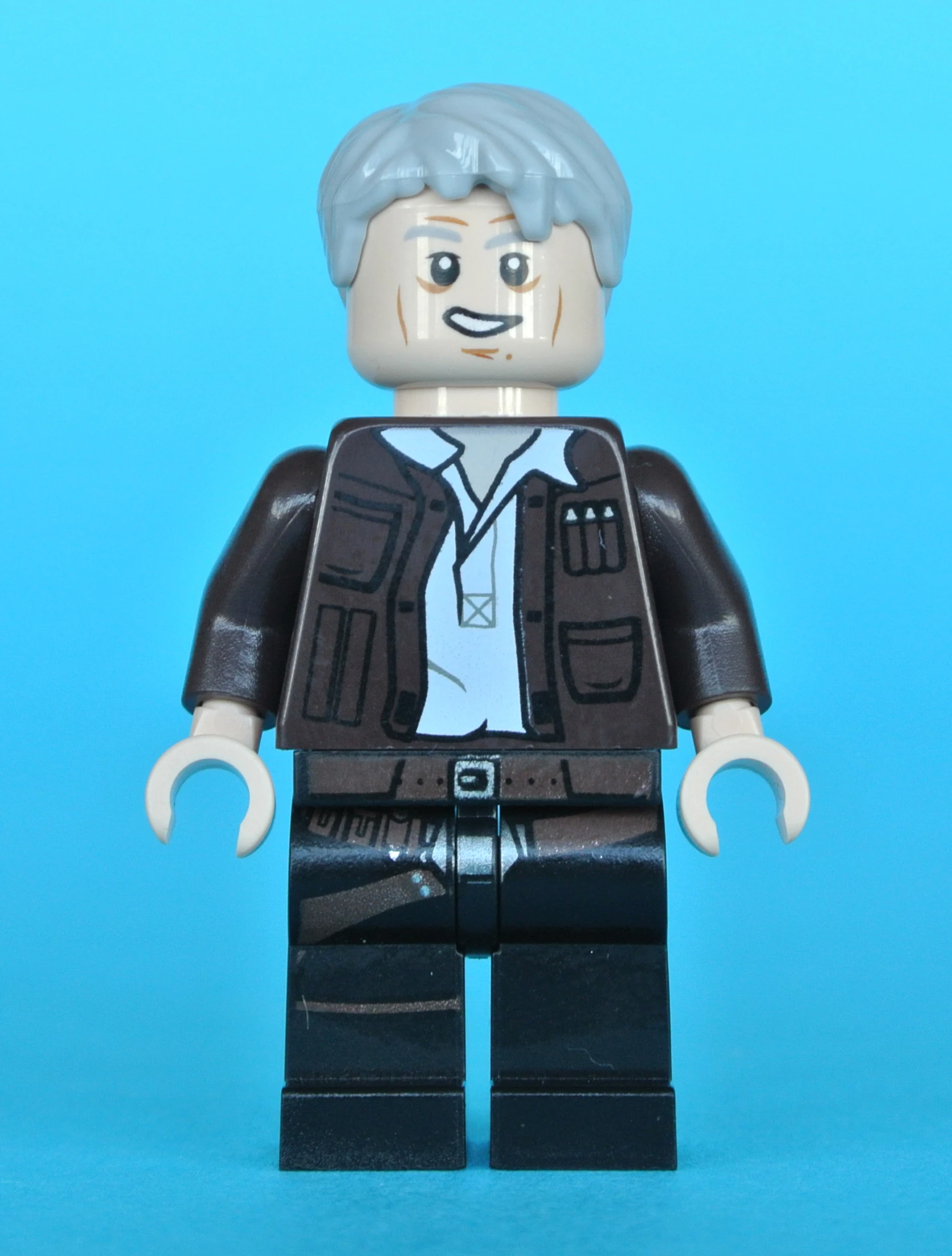 an lego man with gray hair is wearing a suit