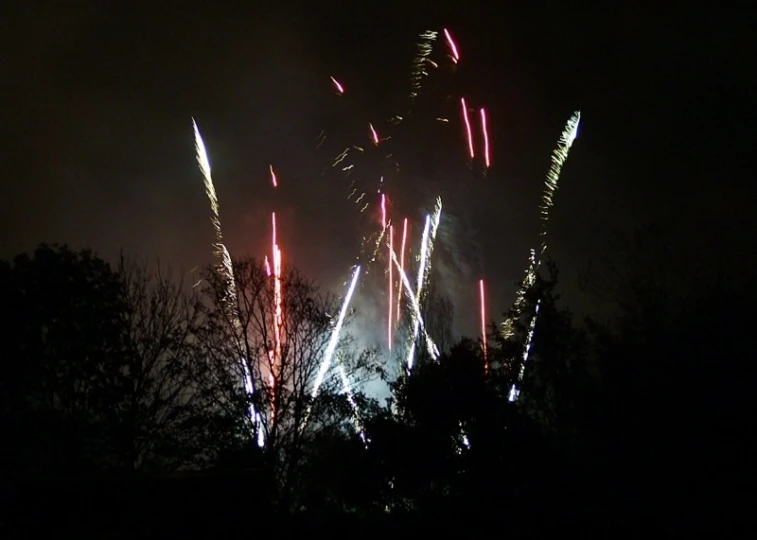 a bunch of fireworks that are very bright and up in the sky