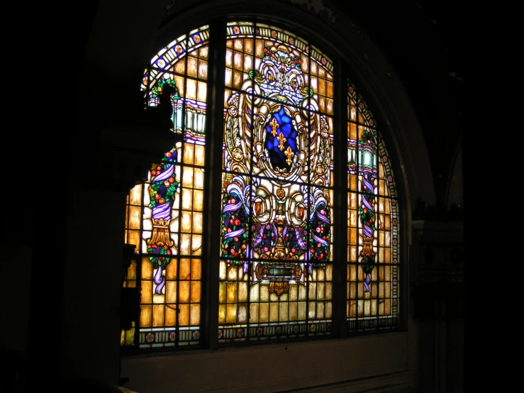 a stained glass window in the middle of a building