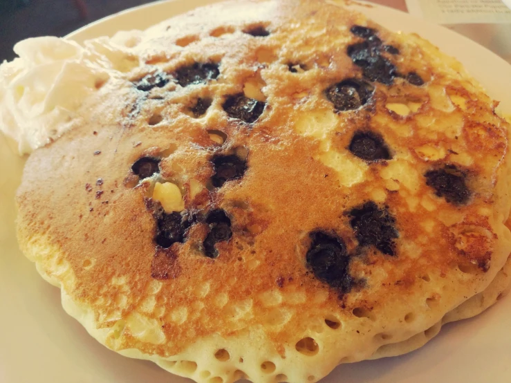 there is a plate with a pancakes and ice cream on it