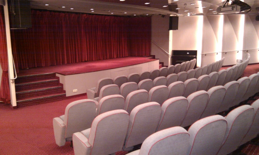 the auditorium is empty except for many people