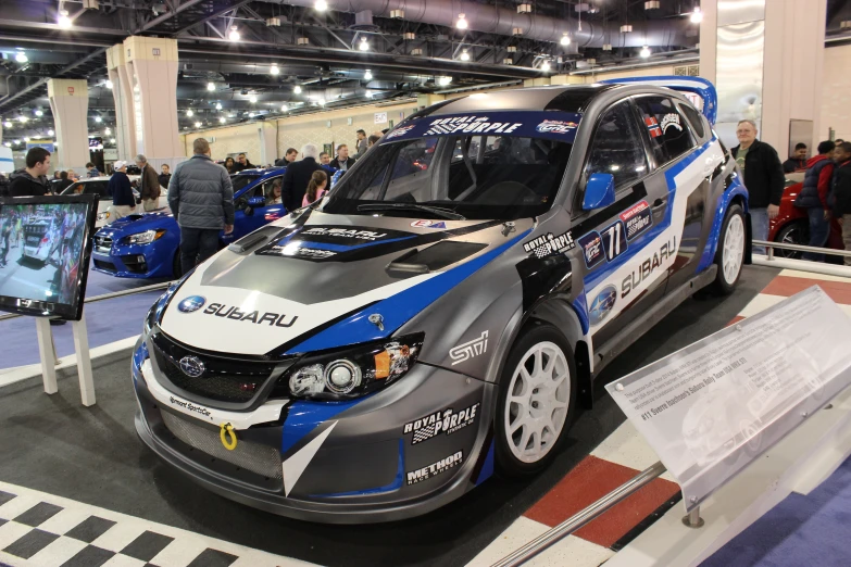 the rally car is on display in the show room