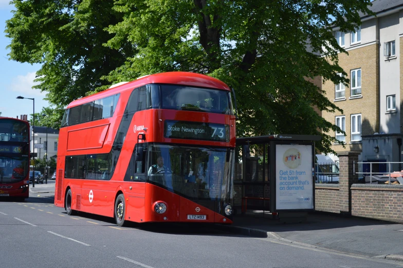 red double decker bus on a city street