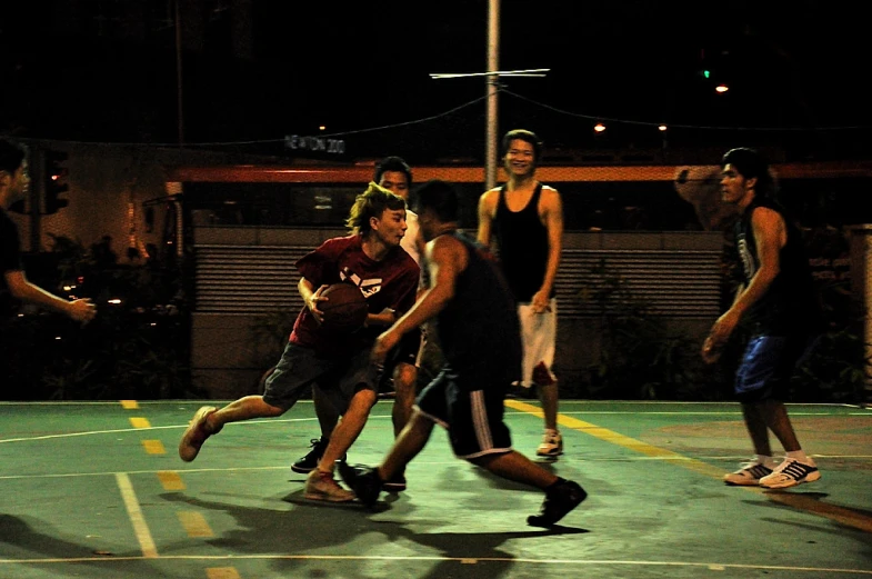 several young people play soccer on an outdoor court