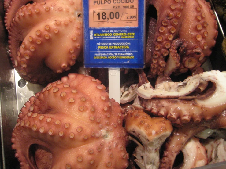an assortment of octo sits in a pile at a market