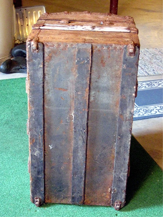 an old wooden trunk hanging from the ceiling