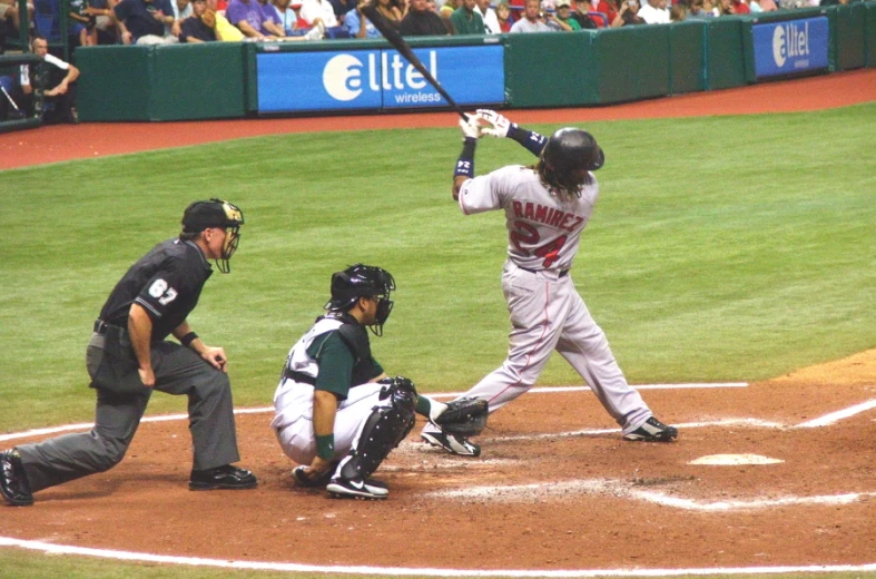 an umpire, catcher and a batter at a baseball game