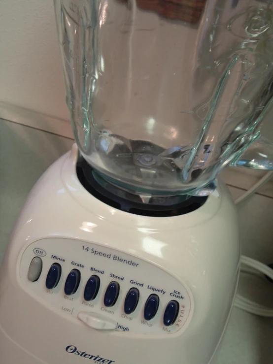 a white blender sitting on top of a counter