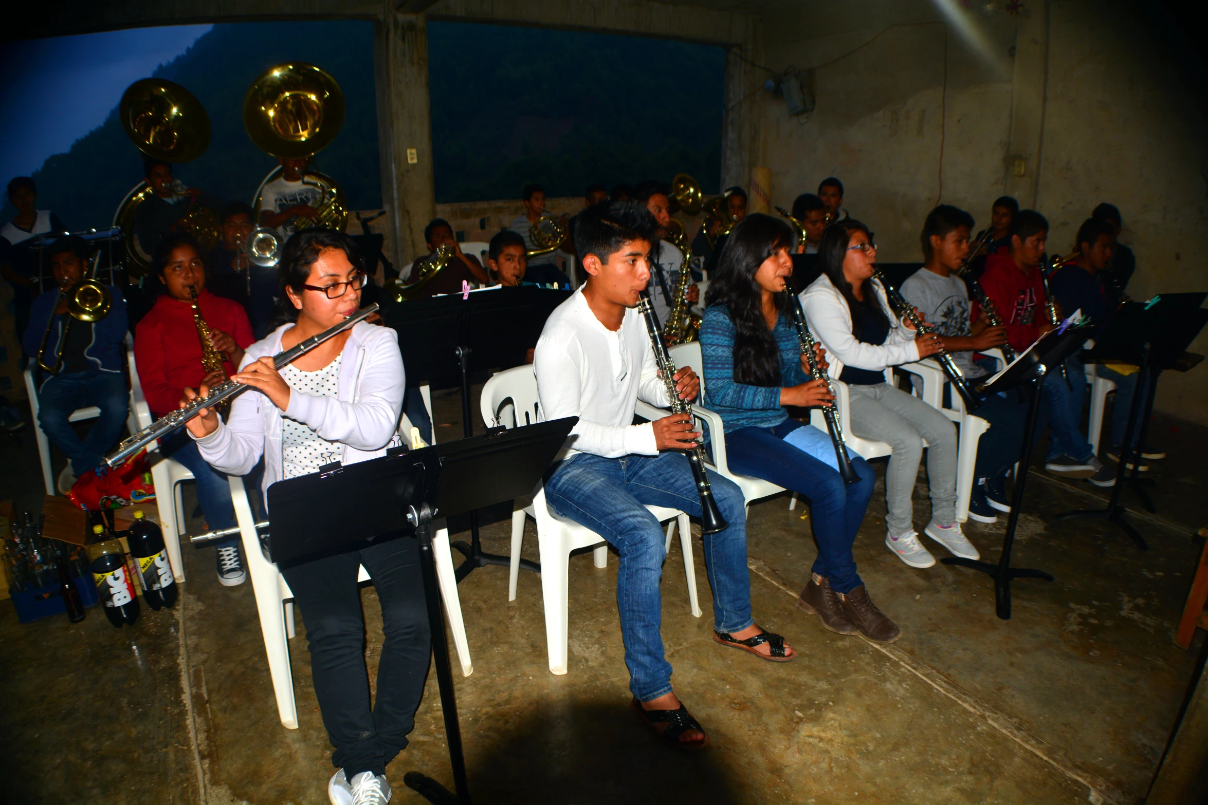 a band and conductor in a large audience