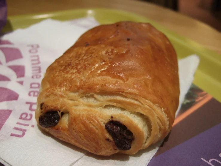 a pastry sitting on top of a napkin