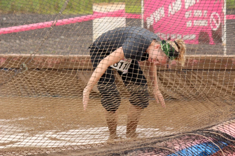 the girl is trying to take a better stance during the race