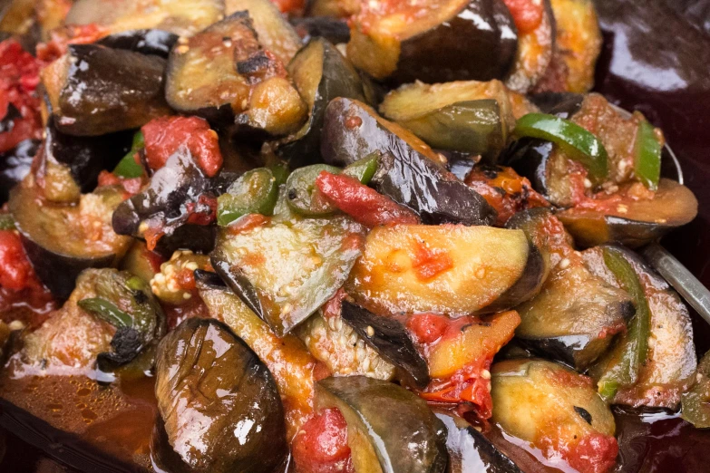 a close up image of a pile of food on a wooden board