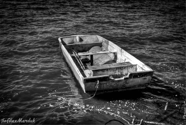 black and white pograph of a boat on water