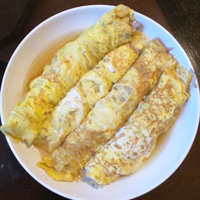 a plate with some french crepes on top of it